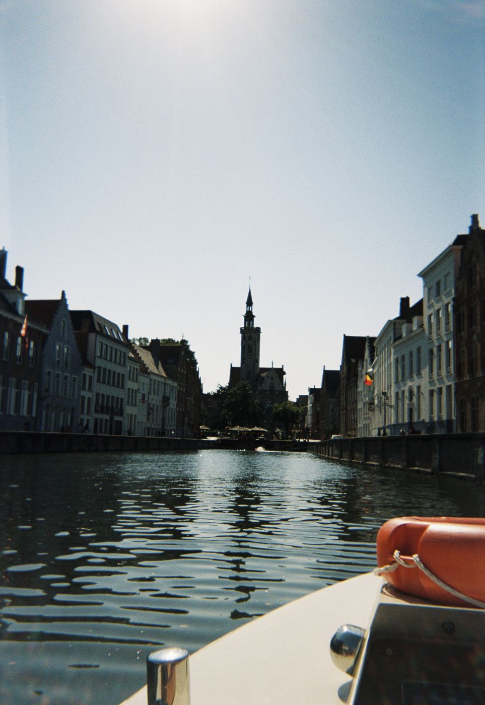 A Bruges canal from the front of a tour boat, on film