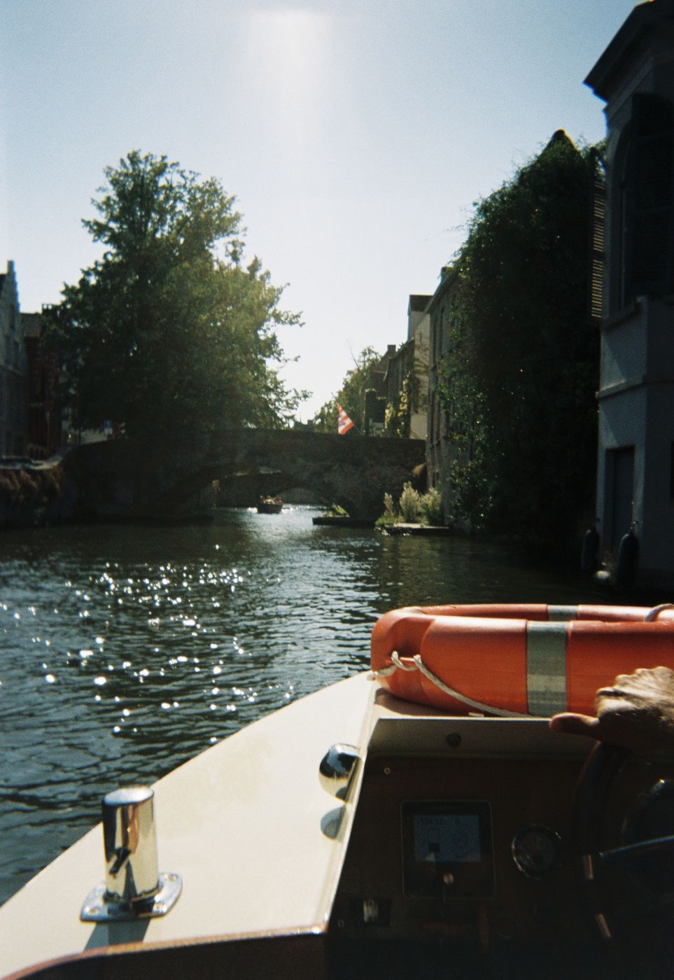Sunlight on the canal from the boat, on film
