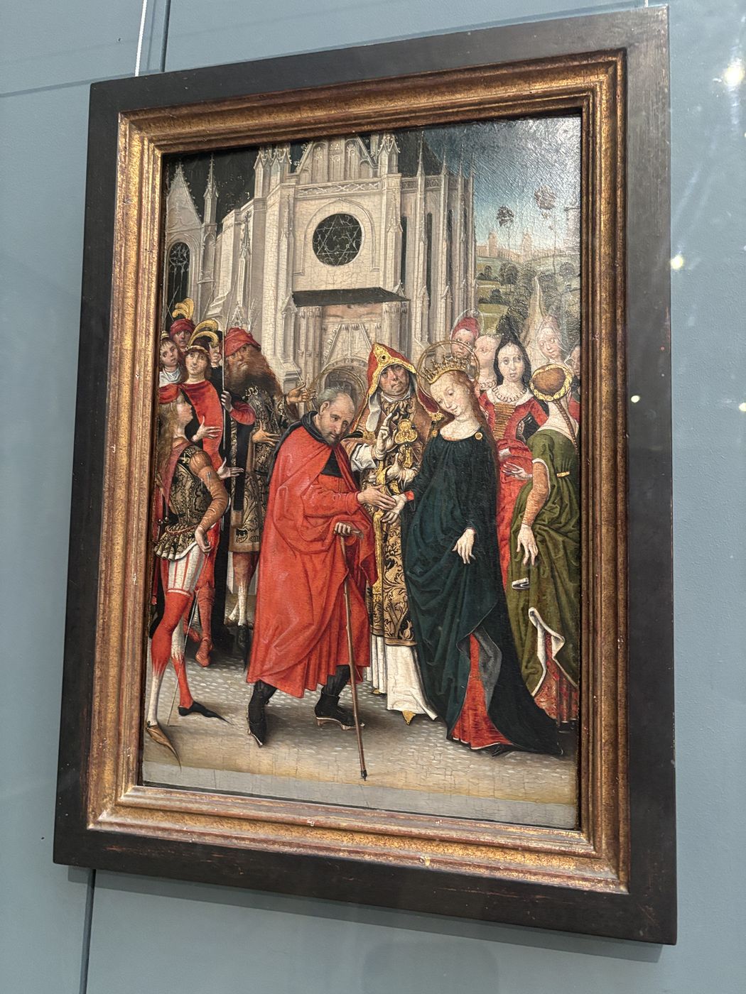 A Flemish panel of saints in red and green robes