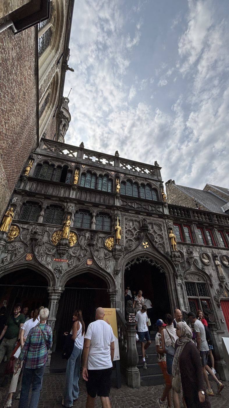 The basilica entrance on Burg Square, with people going in