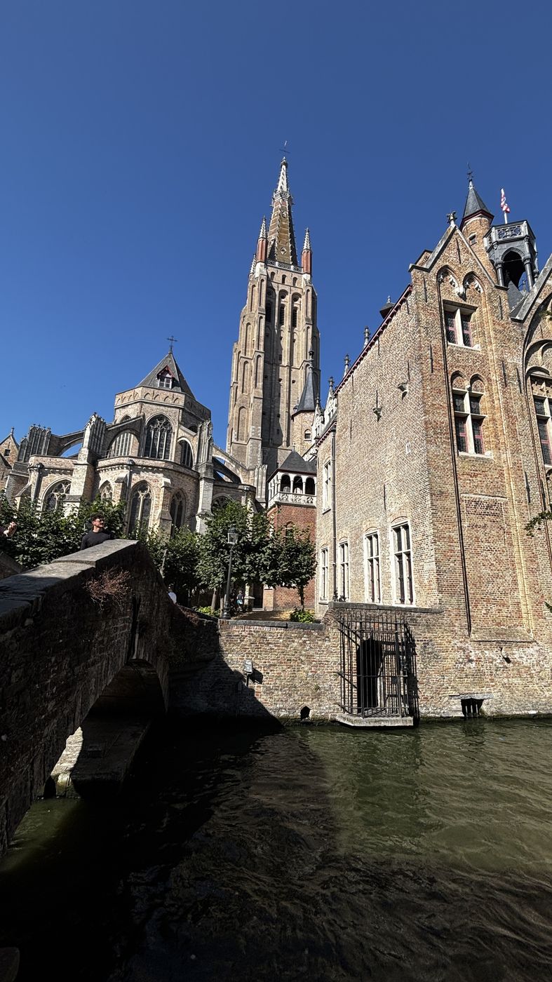 The brick tower of the Church of Our Lady over the canal
