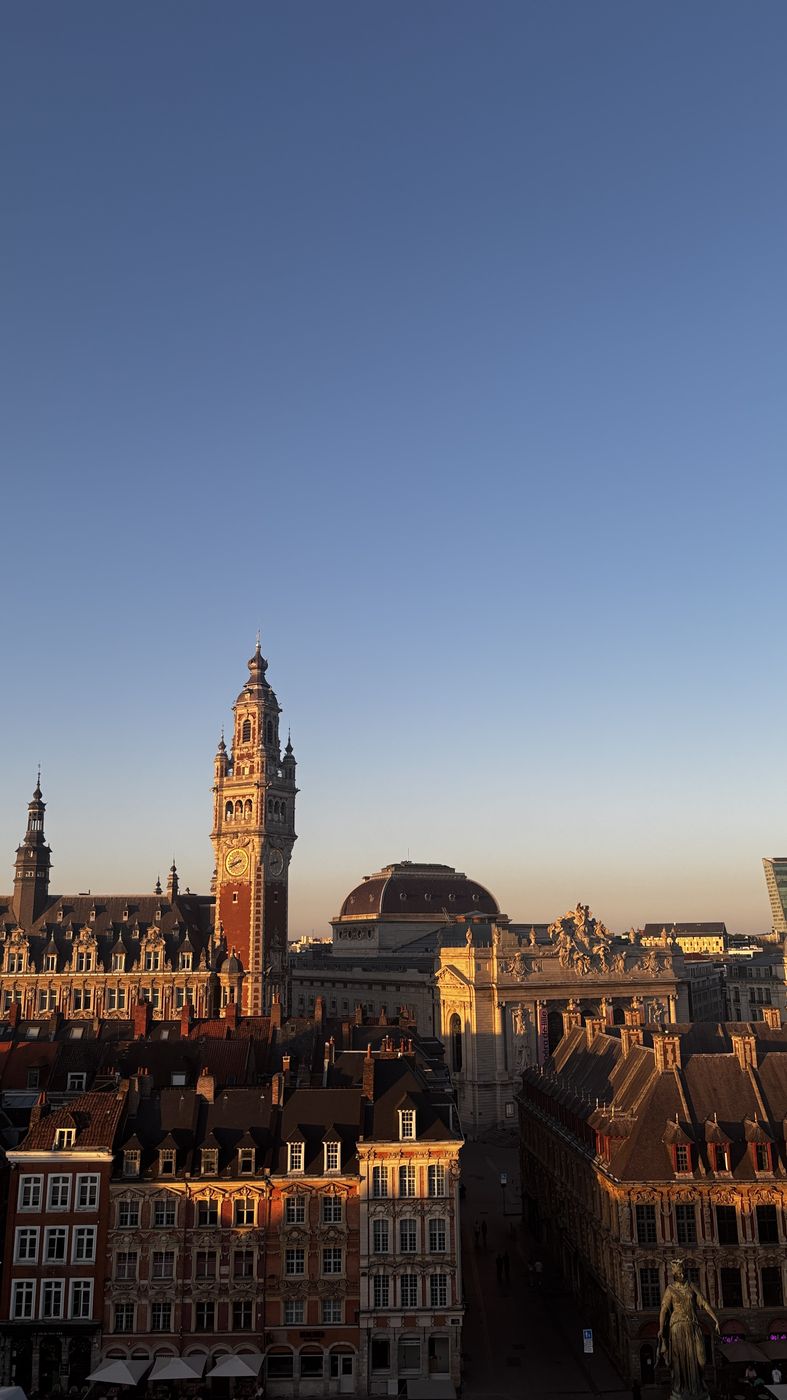 The belfry at golden hour from Le Toit-Terrasse